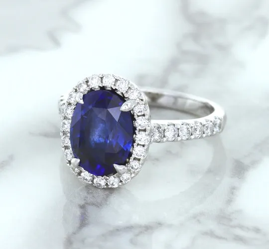 3.68ct. Oval GIA Certified Blue Sapphire Ring with Diamond Halo in 18K White Gold