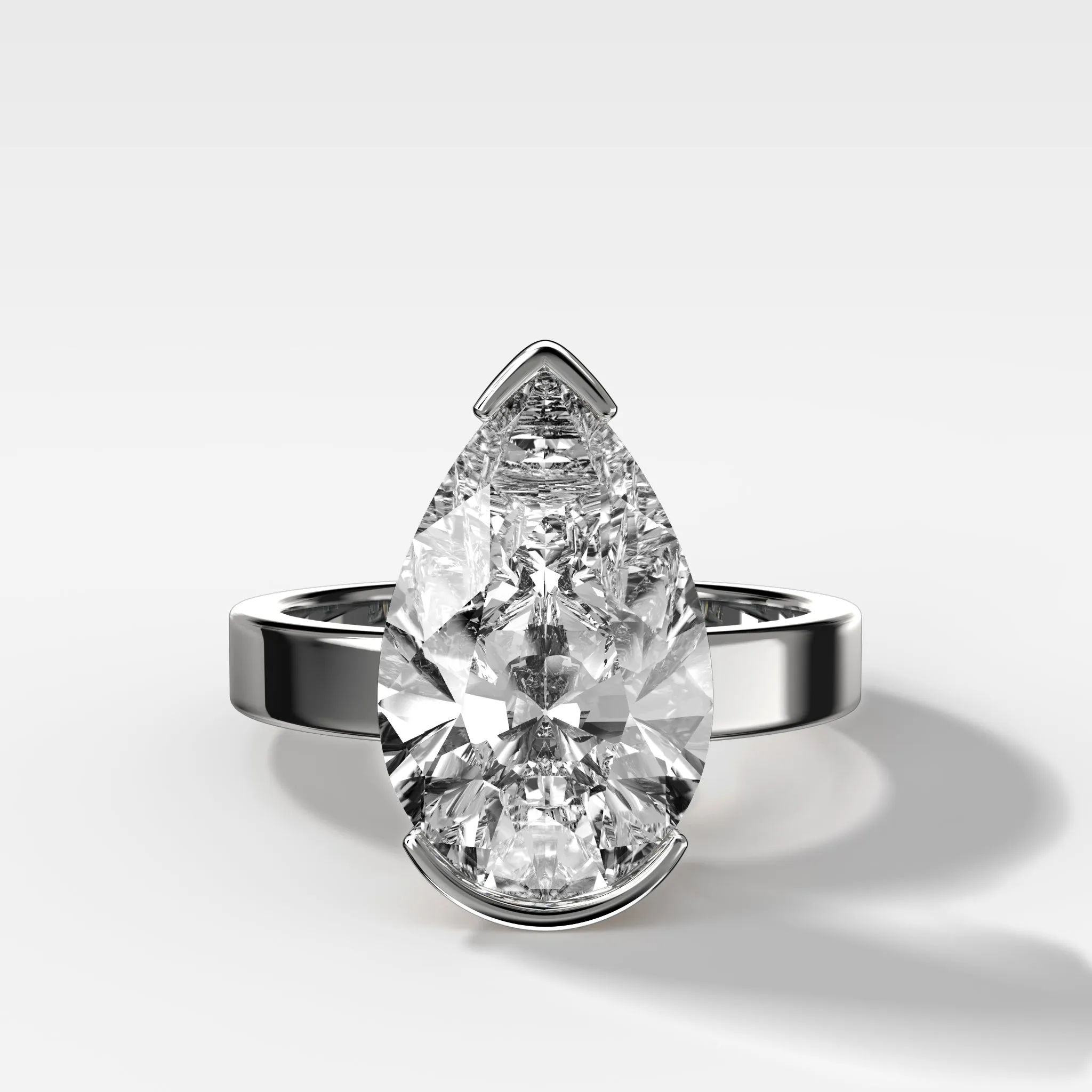 Finest Half Bezel Solitaire Engagement Ring With Pear Cut Diamond