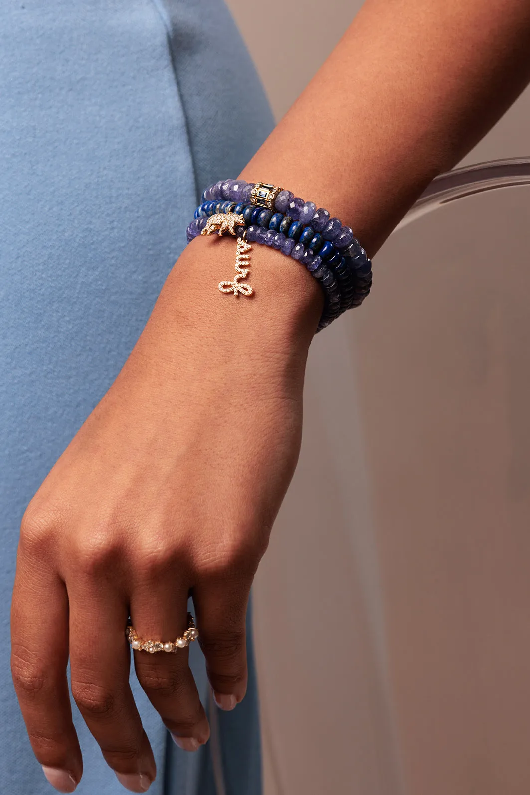 Gold & Diamond Surf Script on Tanzanite